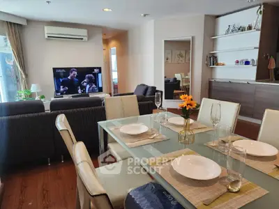 Spacious living and dining area with modern decor and natural light