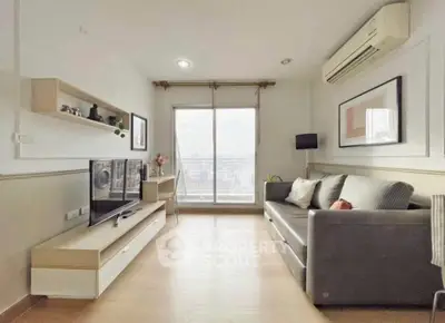 Modern living room with city view, stylish decor, and natural light.