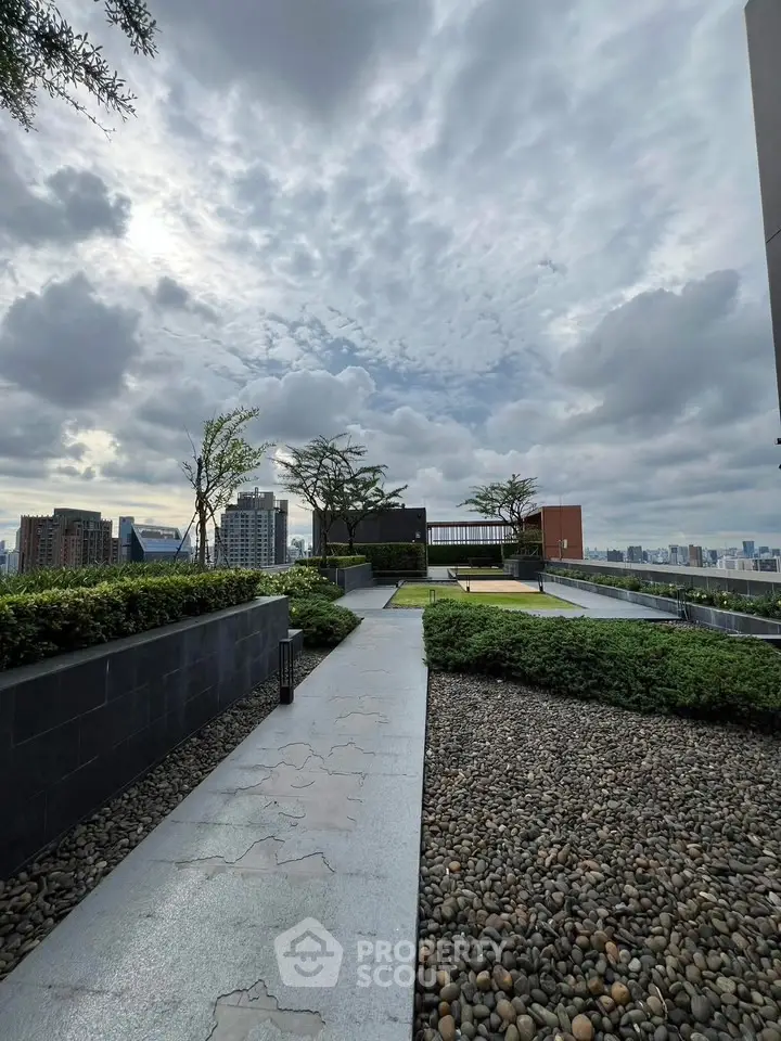 Stunning rooftop garden with panoramic city views and lush greenery.