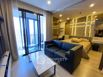 Modern studio apartment with sleek design and balcony view