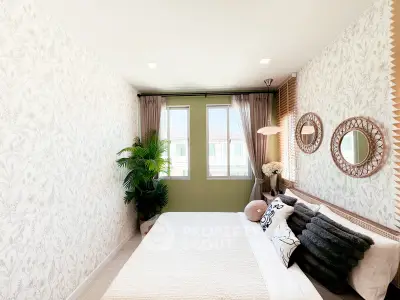 Charming bedroom with stylish decor and ample natural light