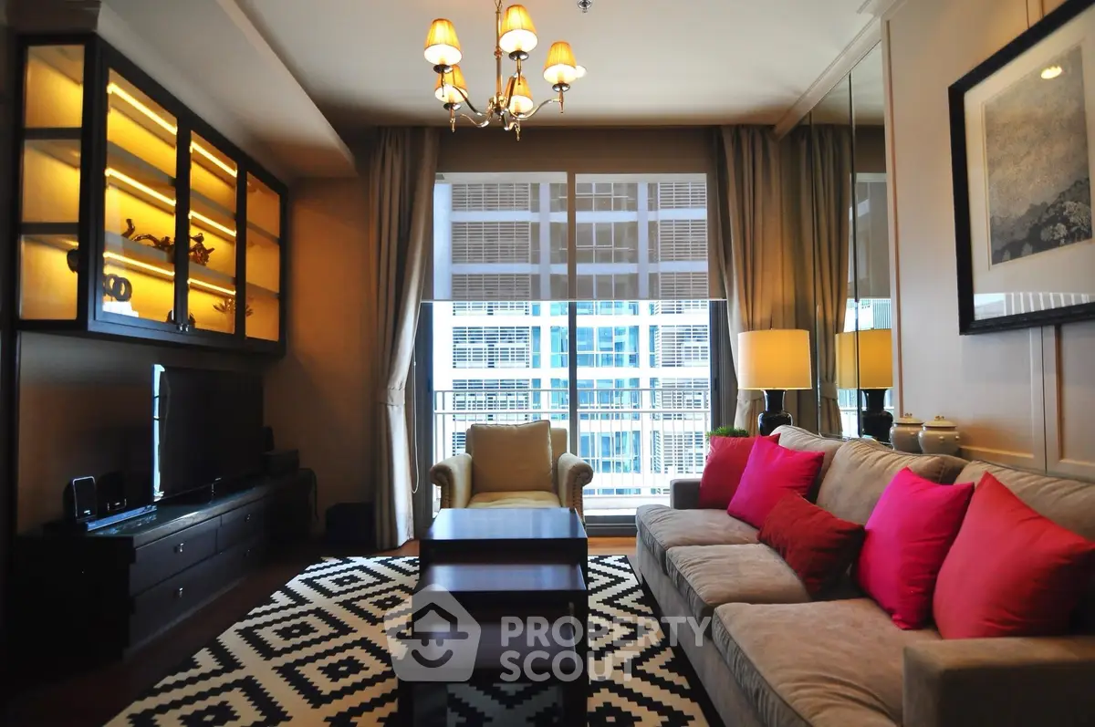 Luxurious living room with elegant decor and large windows offering natural light.