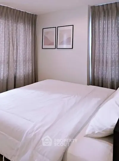 Cozy bedroom with elegant decor and soft lighting, perfect for relaxation and comfort.