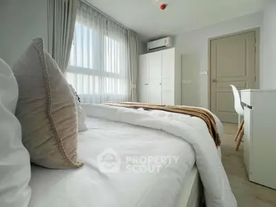 Bright and cozy bedroom with modern furnishings and natural light