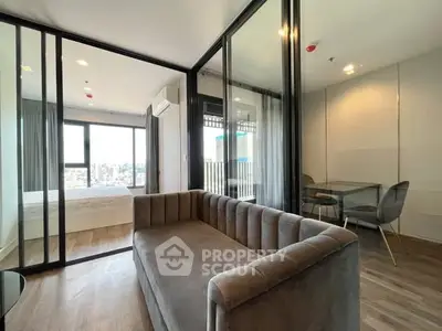 Modern apartment with glass partitions and city view