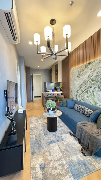 Modern living room with stylish decor and open kitchen layout