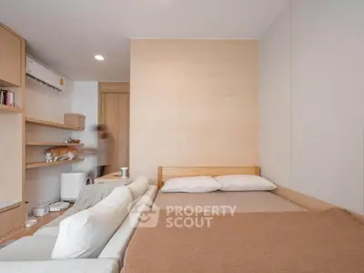 Modern bedroom with cozy bed and stylish wooden accents