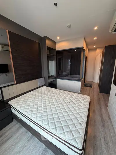 Modern bedroom with stylish decor and large window for natural light