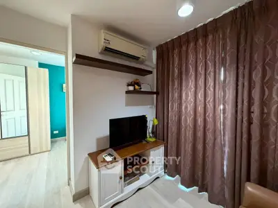 Cozy living room with air conditioning and stylish decor in modern apartment.