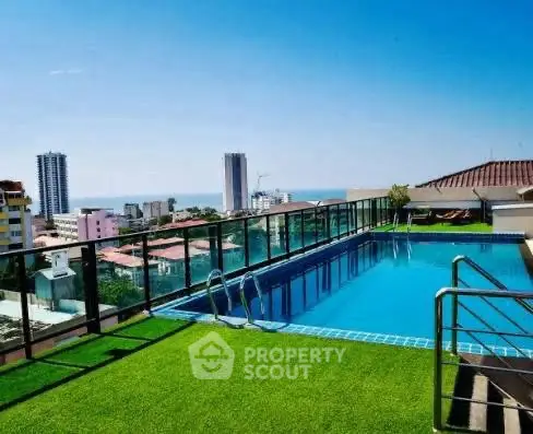 Stunning rooftop pool with panoramic city and ocean views, perfect for luxury living.