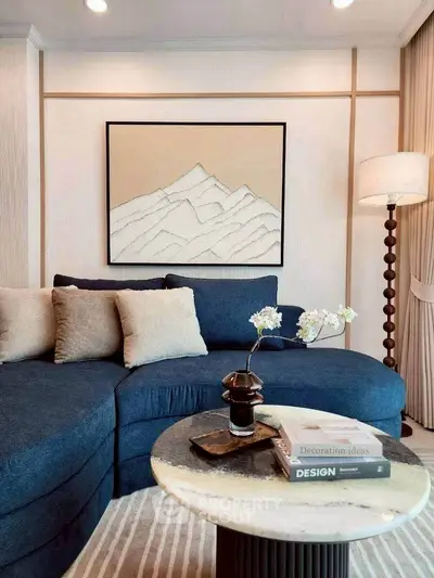 Elegant living room with stylish blue sofa and modern decor