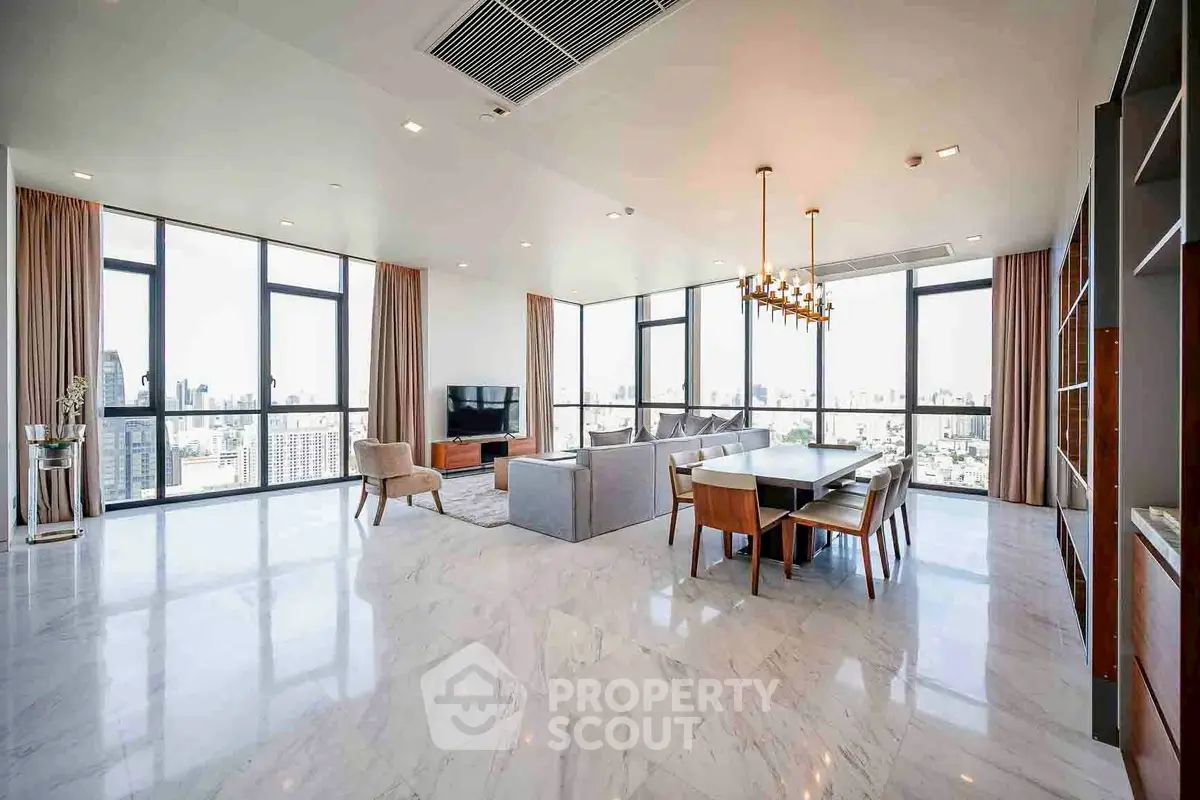 Luxurious open-plan living and dining area with panoramic city views and elegant furnishings.
