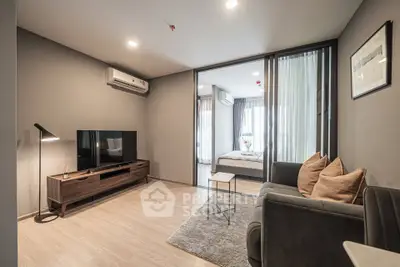Modern living room with sleek furniture and cozy ambiance in a stylish apartment.