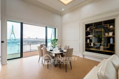 Luxurious dining area with stunning river view and elegant decor