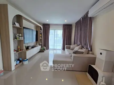 Spacious living room with modern decor and large sectional sofa