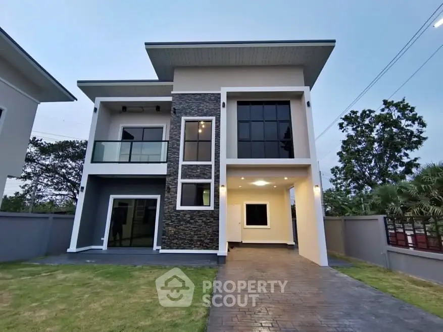 Modern two-story house with sleek design and spacious driveway