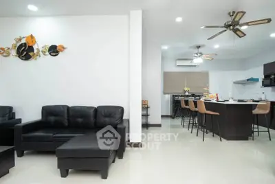 Spacious modern living room with open kitchen and stylish decor