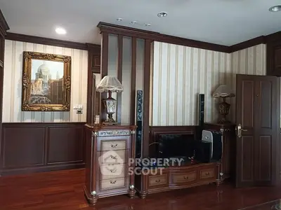 Luxurious living room with elegant wood paneling and classic decor