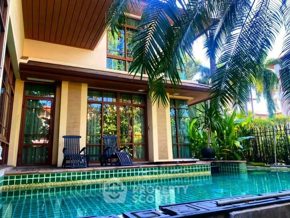 Luxurious villa with private pool and lush garden, perfect for tropical living.