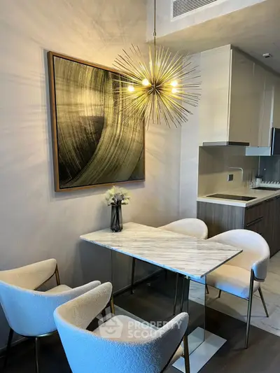 Modern dining area with stylish lighting and elegant decor in a contemporary apartment.