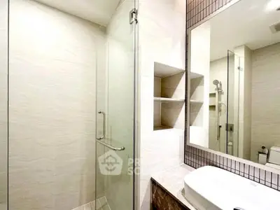 Modern bathroom with glass shower and sleek design