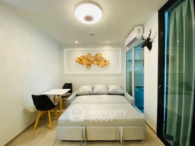 Modern living room with stylish decor and comfortable seating in a cozy apartment.