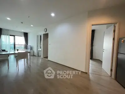 Spacious modern living room with open layout and balcony view