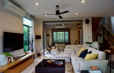 Spacious modern living room with large sectional sofa and stylish decor