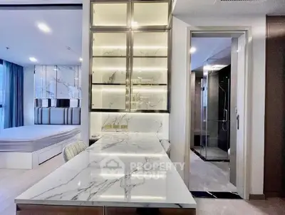 Luxurious modern interior with marble finishes and sleek design, featuring a stylish bedroom and bathroom.