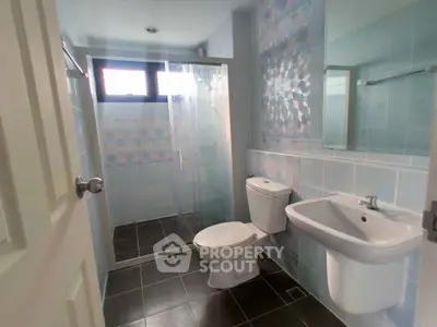 Modern bathroom with glass shower and stylish tiles