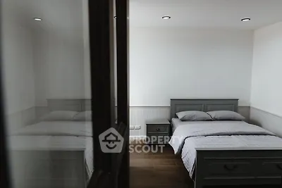 Cozy bedroom with elegant wooden furniture and soft lighting