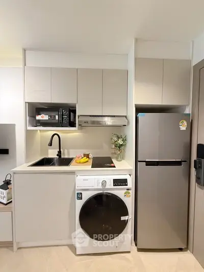 Modern compact kitchen with sleek appliances and efficient layout