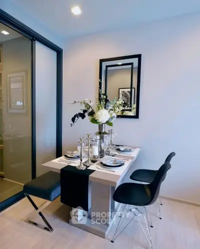 Stylish dining area with elegant table setting and modern decor in a cozy apartment.