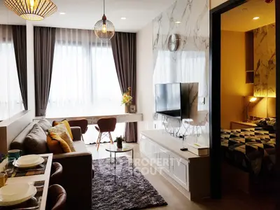 Modern open-plan living room with stylish decor and natural light