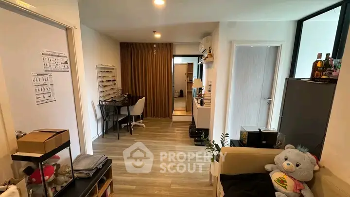 Modern apartment interior with cozy living area and study nook