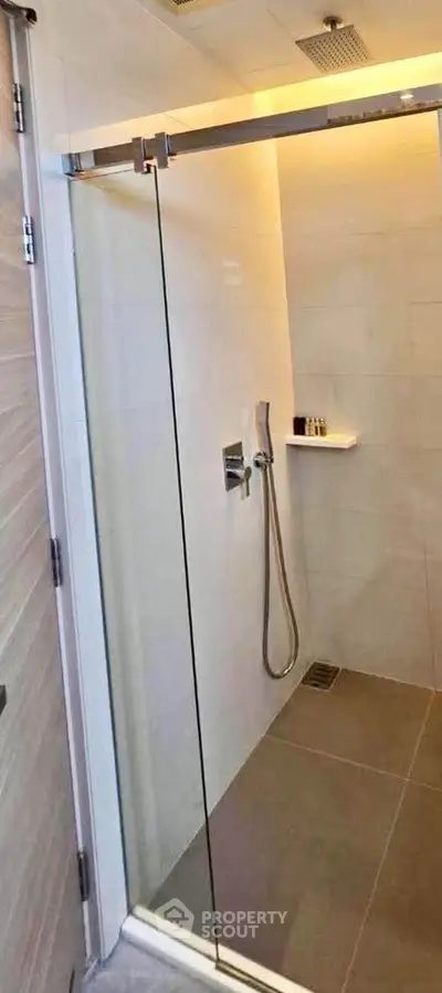 Modern bathroom with sleek shower design and glass door