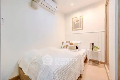 Cozy bedroom with modern decor and air conditioning