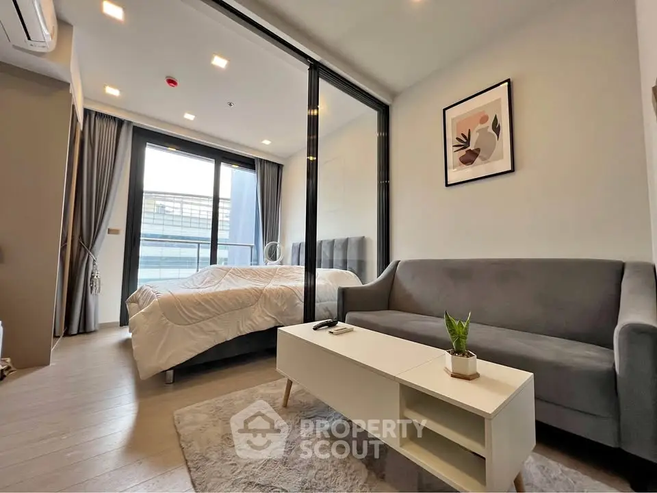 Modern studio apartment with cozy living area and stylish decor
