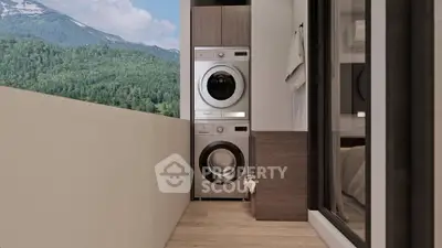 Modern apartment balcony with stacked washer and dryer, offering stunning mountain views.