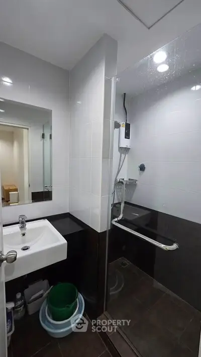 Modern bathroom with sleek design and glass shower enclosure