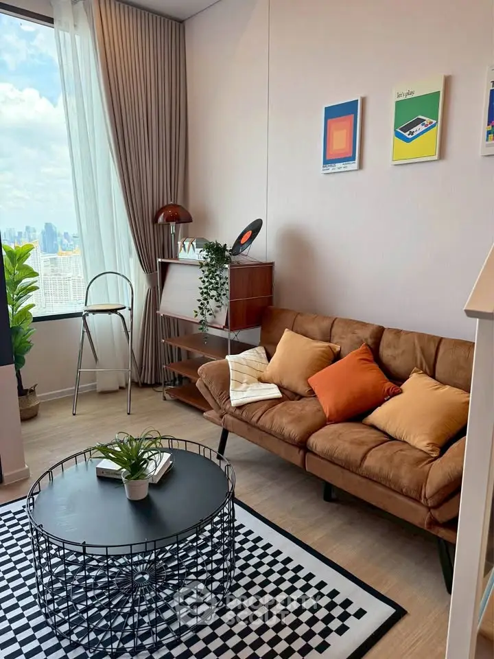 Stylish living room with city view, modern decor, and cozy seating in a high-rise apartment.