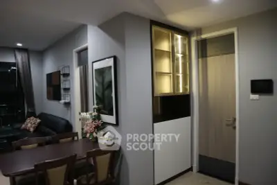 Modern dining area with elegant lighting and stylish decor in a contemporary apartment.