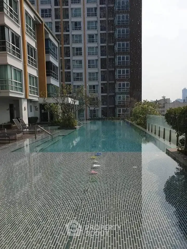 Luxurious condominium with stunning rooftop pool and city views, perfect for urban living.