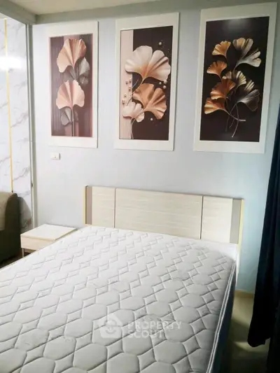 Modern bedroom with stylish decor and comfortable mattress, perfect for relaxation.