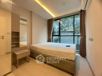 Modern bedroom with large window and minimalist design