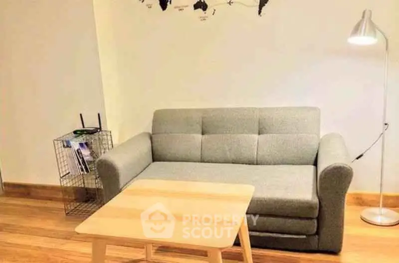 Cozy living room with modern sofa and stylish decor, perfect for relaxation.