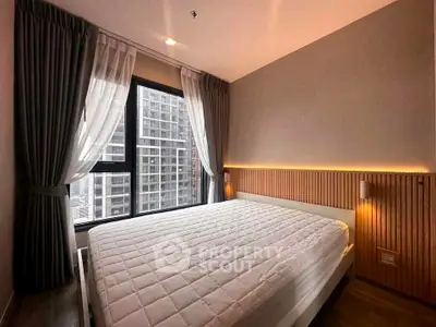 Modern bedroom with large window and stylish lighting in urban apartment
