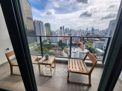 Stunning city view from a modern balcony with stylish wooden furniture, perfect for relaxation.