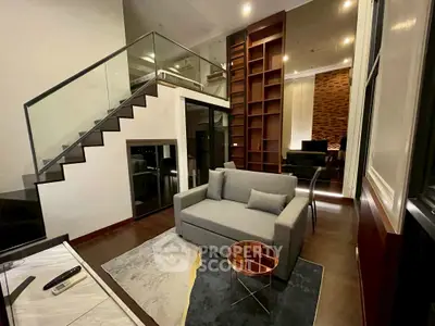 Modern duplex living room with stylish furniture and open staircase