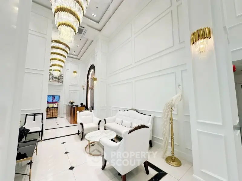 Luxurious white living room with elegant chandeliers and classic furniture